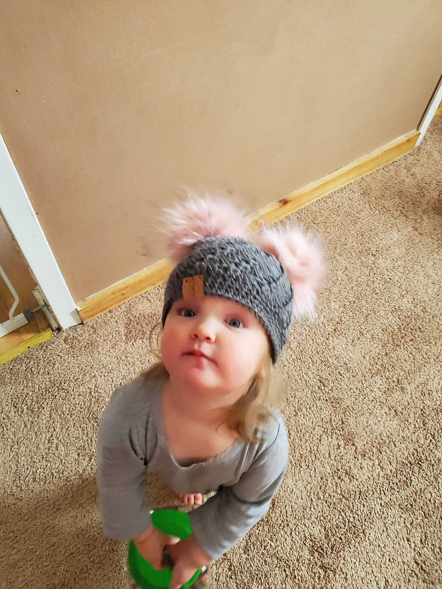 Paisley joined the competition — help win amazing prizes! baby, beanie, bonnet, cap, child, floor, fun, headgear, headwear, person, photography, play, smile, toddler
