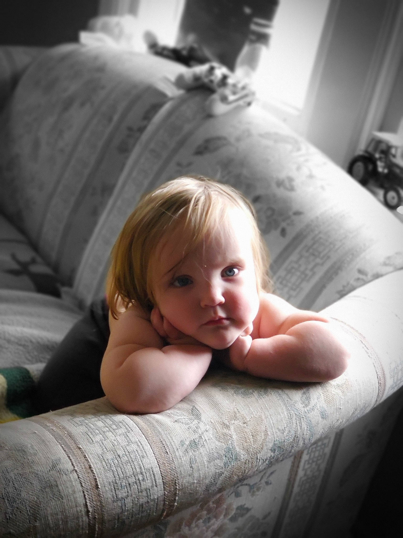 Paisley joined the competition — help win amazing prizes! arm, baby, beauty, blond, child, comfort, eye, face, furniture, hand, leg, person, photograph, photography, portrait, portrait_photography, sitting, skin, smile, toddler