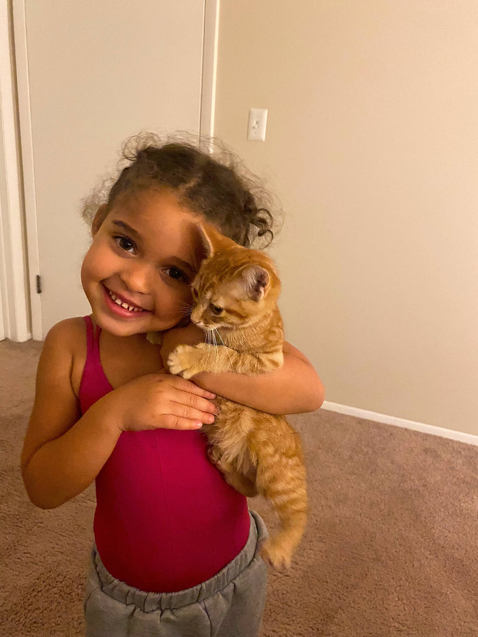 Avianna is registered to the contest to win money with this photo: abdomen, arm, blond, brown_hair, companion_dog, fawn, felidae, flooring, fur, gesture, happy, iris, joint, joy, long_hair, neck, person, shoulder, smile, toddler