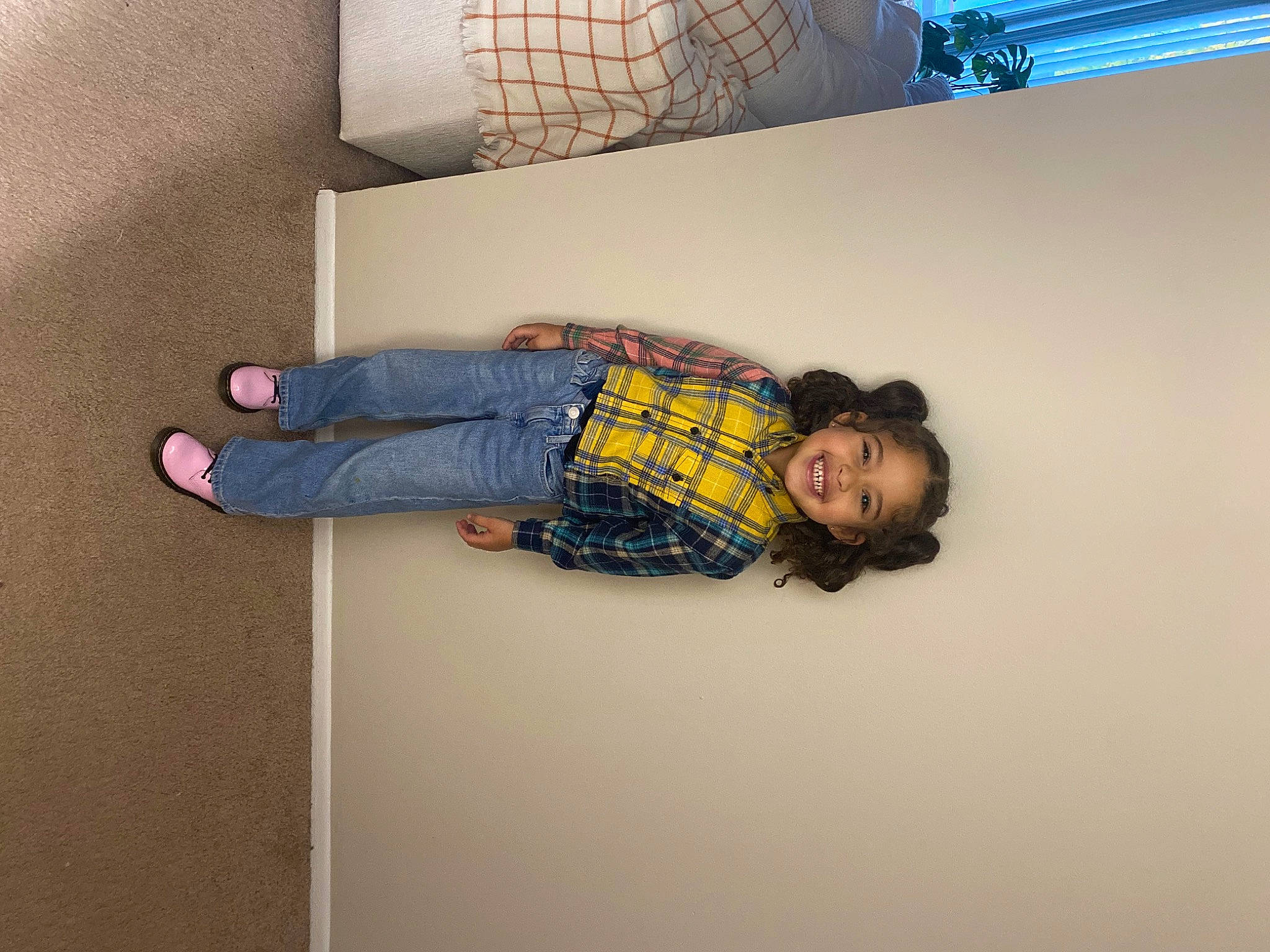 Avianna is registered to the contest to win money with this photo: ceiling, comfort, couch, denim, flooring, fun, human_leg, joy, knee, linens, pattern, person, room, sitting, smile, t_shirt, textile, thigh