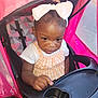 Samiera joined the competition — help win amazing prizes! toddler, child, stroller, pink, bow, headband, tray, seatbelt, curious, baby, clothing, white, orange, checkered, indoor, portrait, person, infant, cute, seat