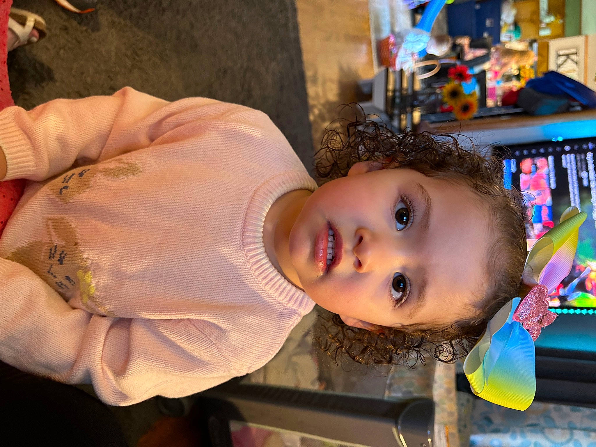 Addison is registered to the contest to win money with this photo: cheek, child, fun, happy, iris, leisure, nose, person, retail, shelf, toddler, toy, tree