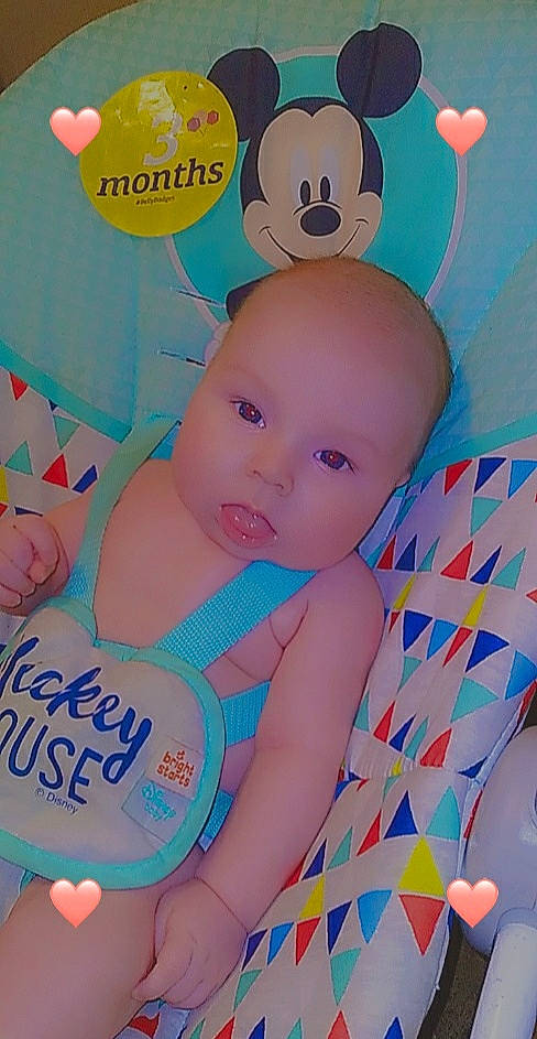 Luke Ashelie is registered to the contest to win money with this photo: art, baby, baby_products, baby_toddler_clothing, cheek, child, dessert, facial_expression, font, happy, linens, pattern, person, pink, product, sitting, skin, textile, toddler, toy