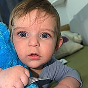 Isaiah a rejoint le concours — aidez-le/la à gagner de superbes lots ! baby, blue_eyes, blanket, child, clothing, cute, face, hand, indoor, infant, looking, person, plush, portrait, skin, soft, toy, young, youth, toddler