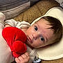 Isaiah participe au concours pour gagner de l'argent avec cette photo : baby, blanket, blue_eyes, carpet, cozy, cute, expression, face, hand, head_support, indoors, infant, lying_down, newborn, pacifier, plush_toy, portrait, red_heart, soft_lighting, white_clothing