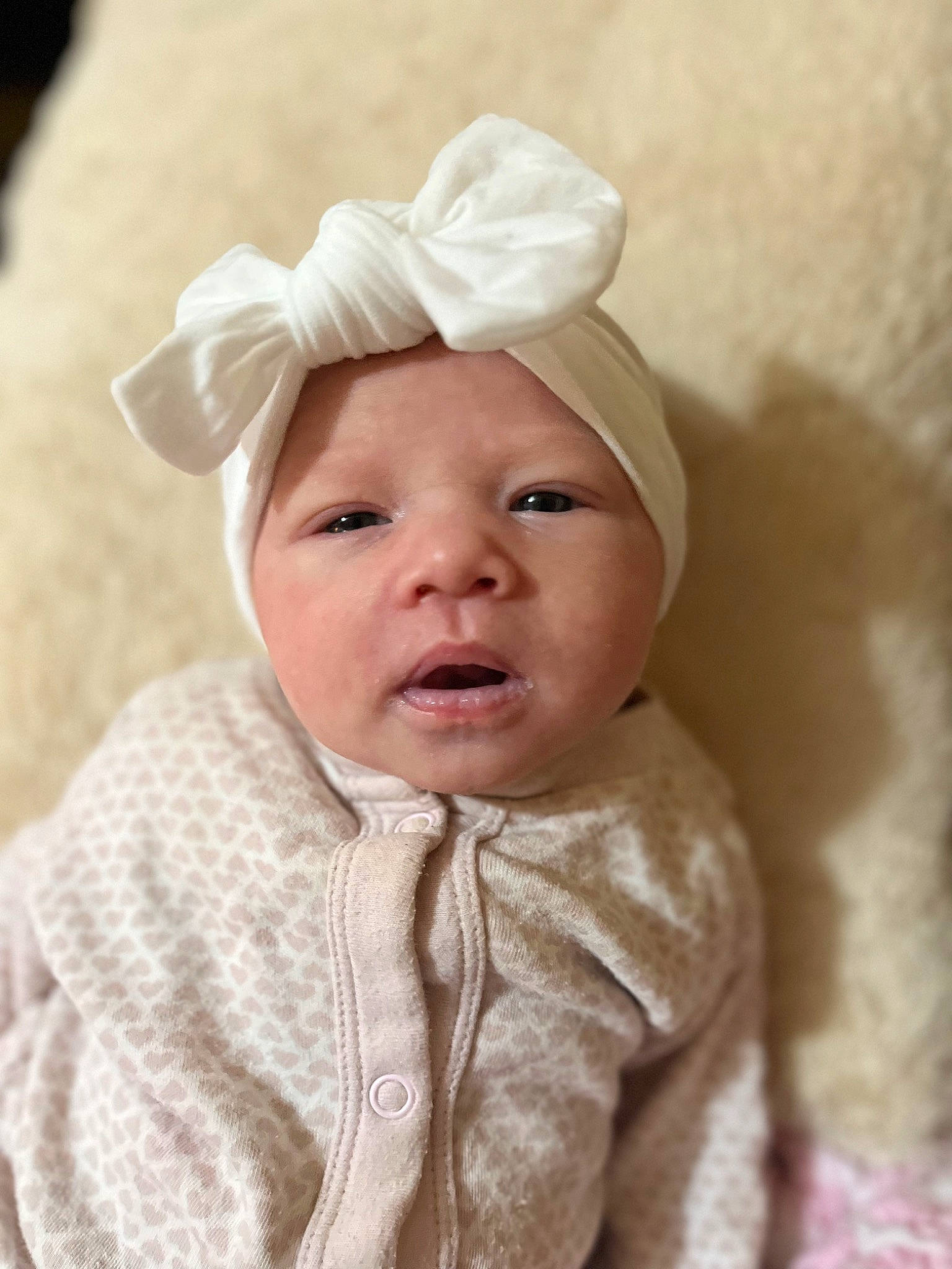 Ivy is registered to the contest to win money with this photo: baby, baby_toddler_clothing, cheek, child, chin, collar, comfort, eyebrow, face, fashion_accessory, hair_accessory, happy, head, headgear, headwear, linens, lip, person, portrait_photography, skin