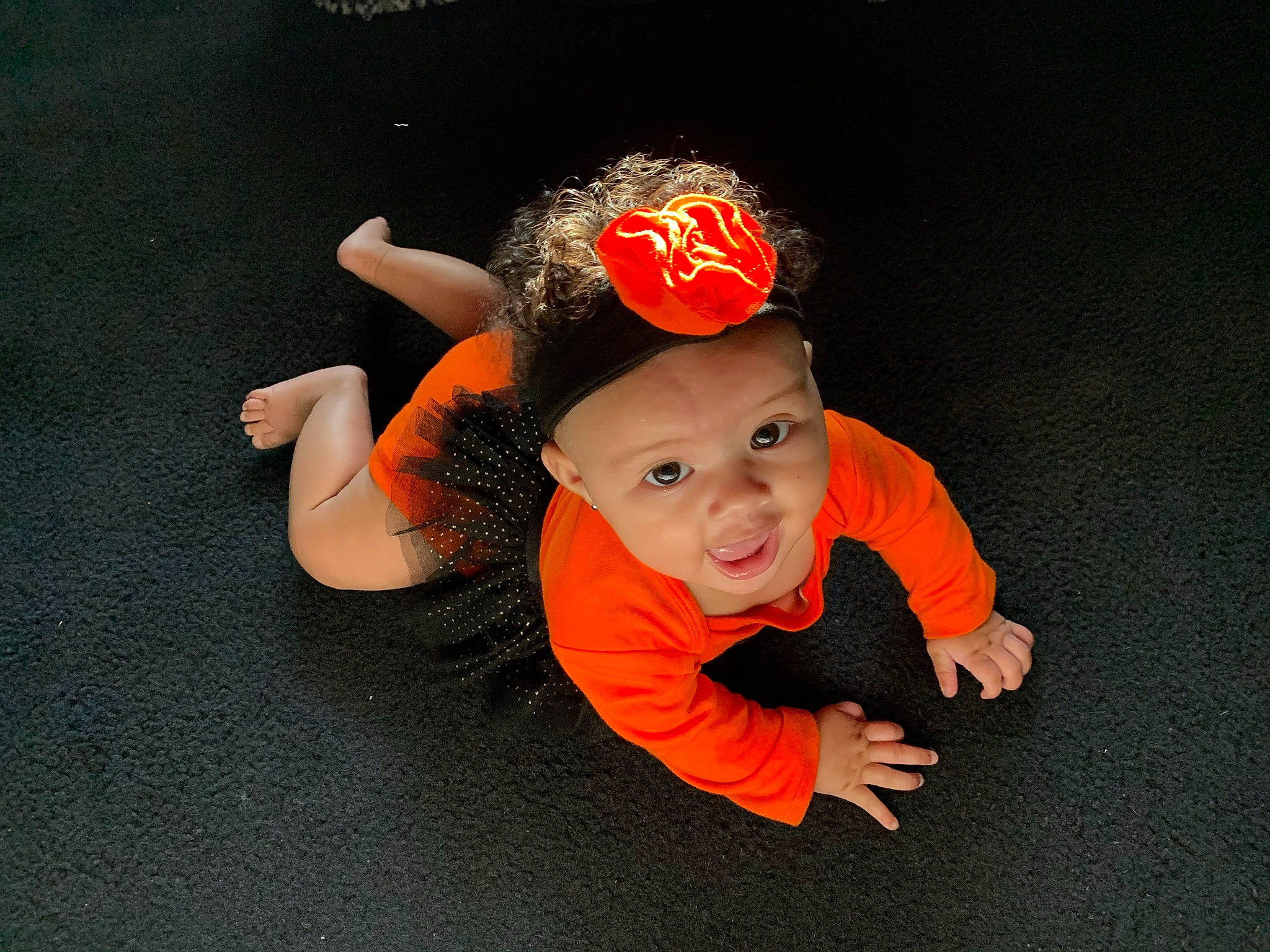 Mariyah is registered to the contest to win money with this photo: child, costume, fun, hair_accessory, head, headband, headgear, headpiece, headwear, orange, person, photography, smile, toddler