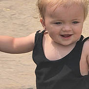 Masie is registered to the contest to win money with this photo: black_clothing, casual, child, cute, daylight, earrings, exploring, face, greenery, happy, joy, nature, outdoor, person, playful, ponytail, skin, smiling, toddler, young_child