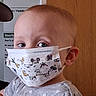 toddler, child, face_mask, mickey_mouse, indoor, grey_shirt, heart_pattern, pink_bow, curious, portrait, young_child, person, head, eyes, mask, health, protection, cute, baby, expression