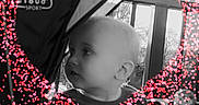 Rebekah joined the competition — help win amazing prizes! baby, stroller, child, heart_shape, overlay, dots, black_and_white, curious, infant, outdoor, window, face, cute, seat, person, side_view, expression, young_child, playful, decoration