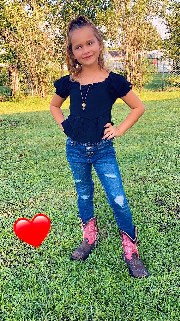 Devyn is registered to the contest to win money with this photo: denim, electric_blue, fun, grass, happy, human_leg, joy, knee, lawn, leg, leisure, meadow, people_in_nature, person, plant, shoe, smile, summer, t_shirt, thigh