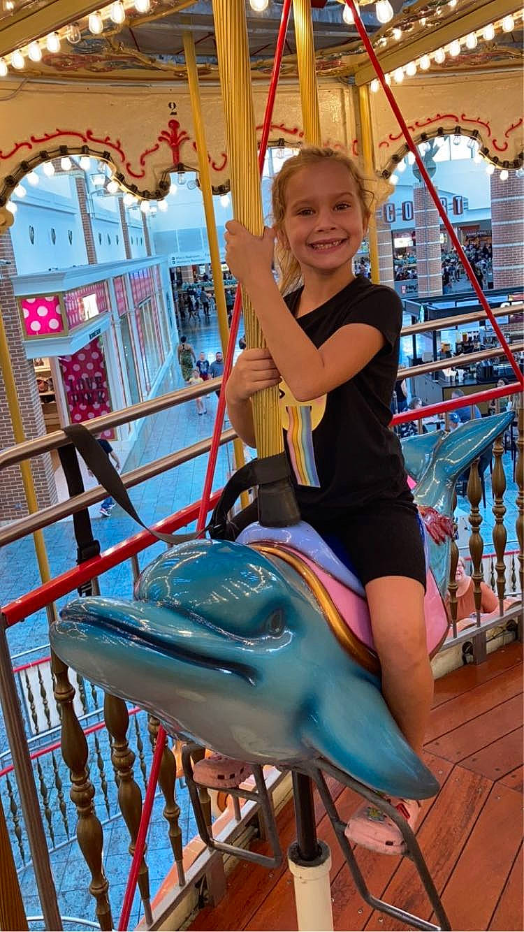 Devyn joined the competition — help win amazing prizes! amusement_park, amusement_ride, carousel, child, chute, city, event, fish, fun, happy, joy, leisure, nonbuilding_structure, outdoor_play_equipment, person, playground, recreation, smile, thigh, toddler