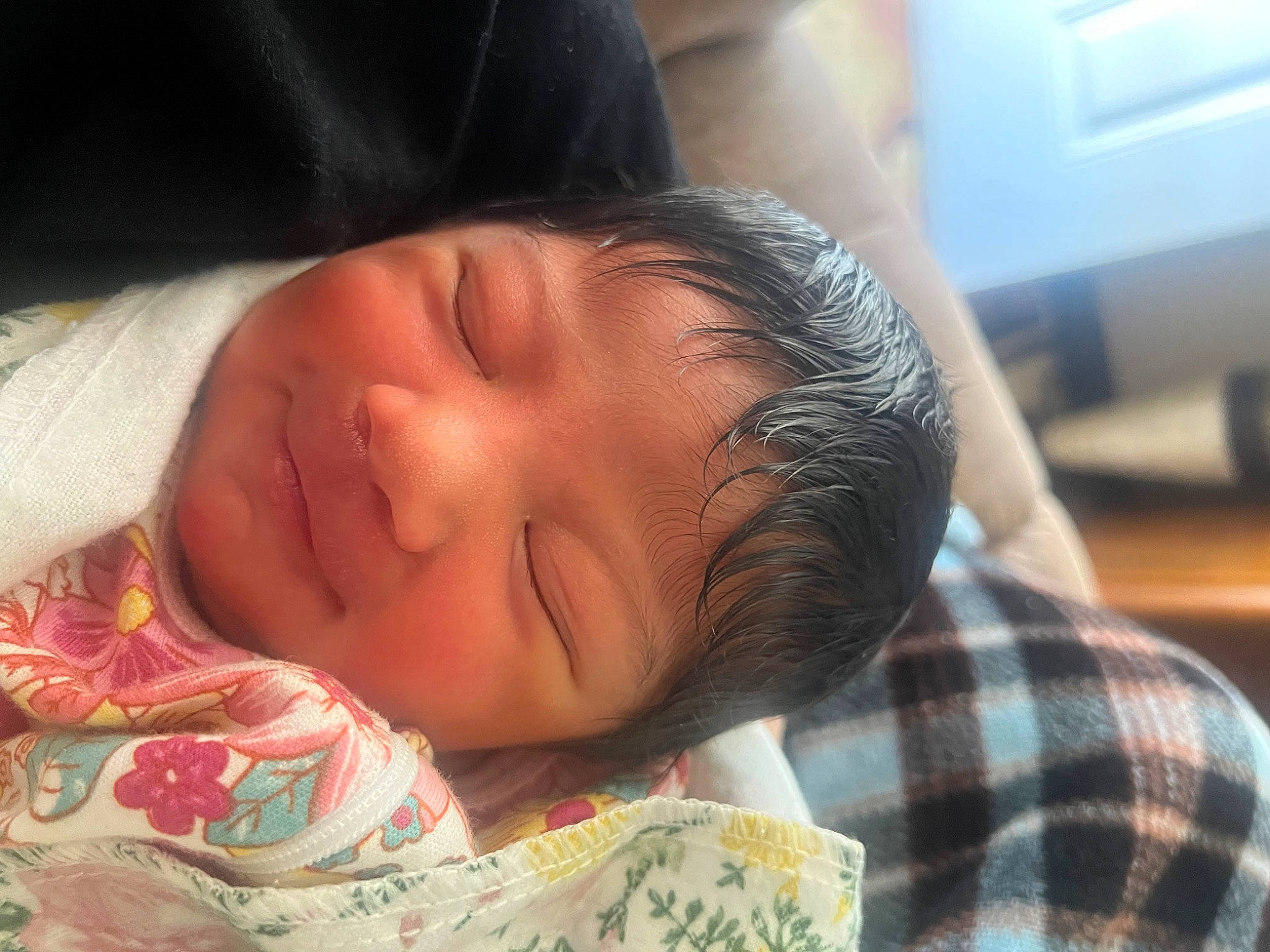 Mia is registered to the contest to win money with this photo: baby, baby_toddler_clothing, bedtime, cheek, comfort, ear, eyebrow, eyelash, forehead, happy, iris, lip, nose, pattern, person, plaid, skin, sleeve, smile, tartan