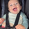 baby, smiling, car_seat, happiness, child, safety_harness, cute, infant, clothing, pink_shorts, happy, expression, seatbelt, person, portrait, indoor, light, closeup, skin, hand