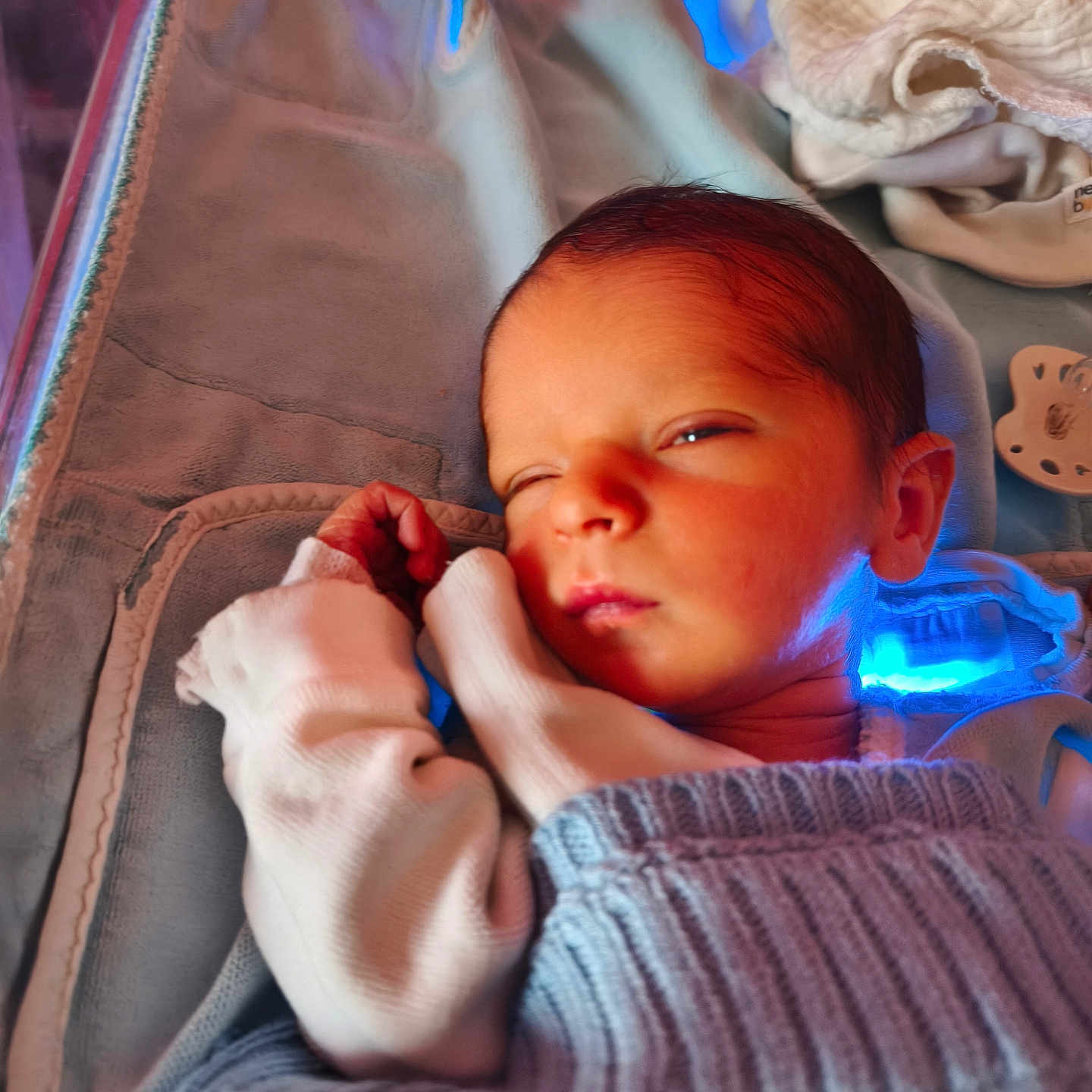 Ayden participe au concours pour gagner de l'argent avec cette photo : baby, blanket, blue_light, child, cozy, cute, fabric, face, hand, indoors, infant, knitwear, newborn, peaceful, portrait, resting, sleeping, soft, swaddled, warm_light