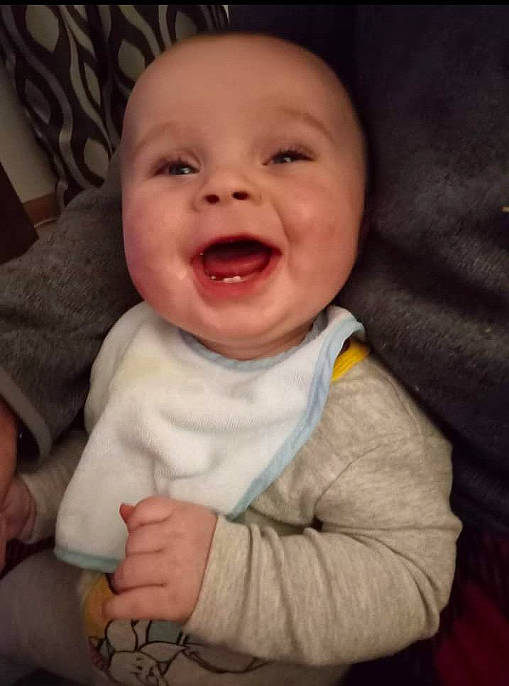 Braeden is registered to the contest to win money with this photo: baby_toddler_clothing, cheek, chin, comfort, ear, eye, eyebrow, face, gesture, happy, head, iris, lip, mouth, nose, outerwear, person, skin, sleeve, smile