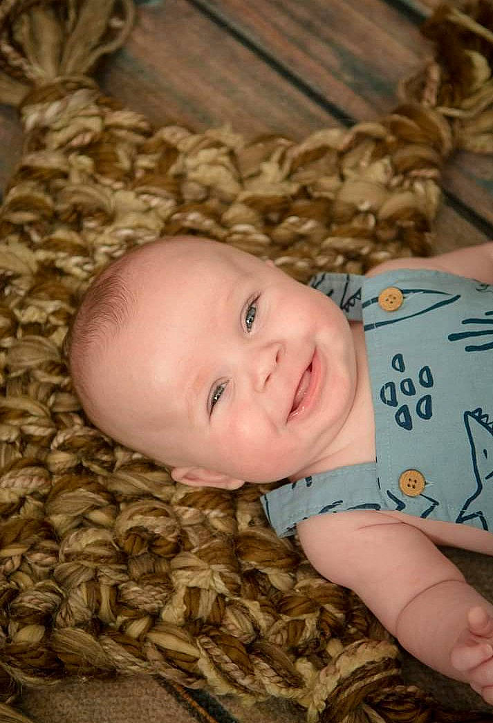 Braeden joined the competition — help win amazing prizes! baby, baby_toddler_clothing, brown, cheek, chin, comfort, eye, face, flooring, grass, hairstyle, happy, head, iris, joy, mouth, nose, person, skin, smile