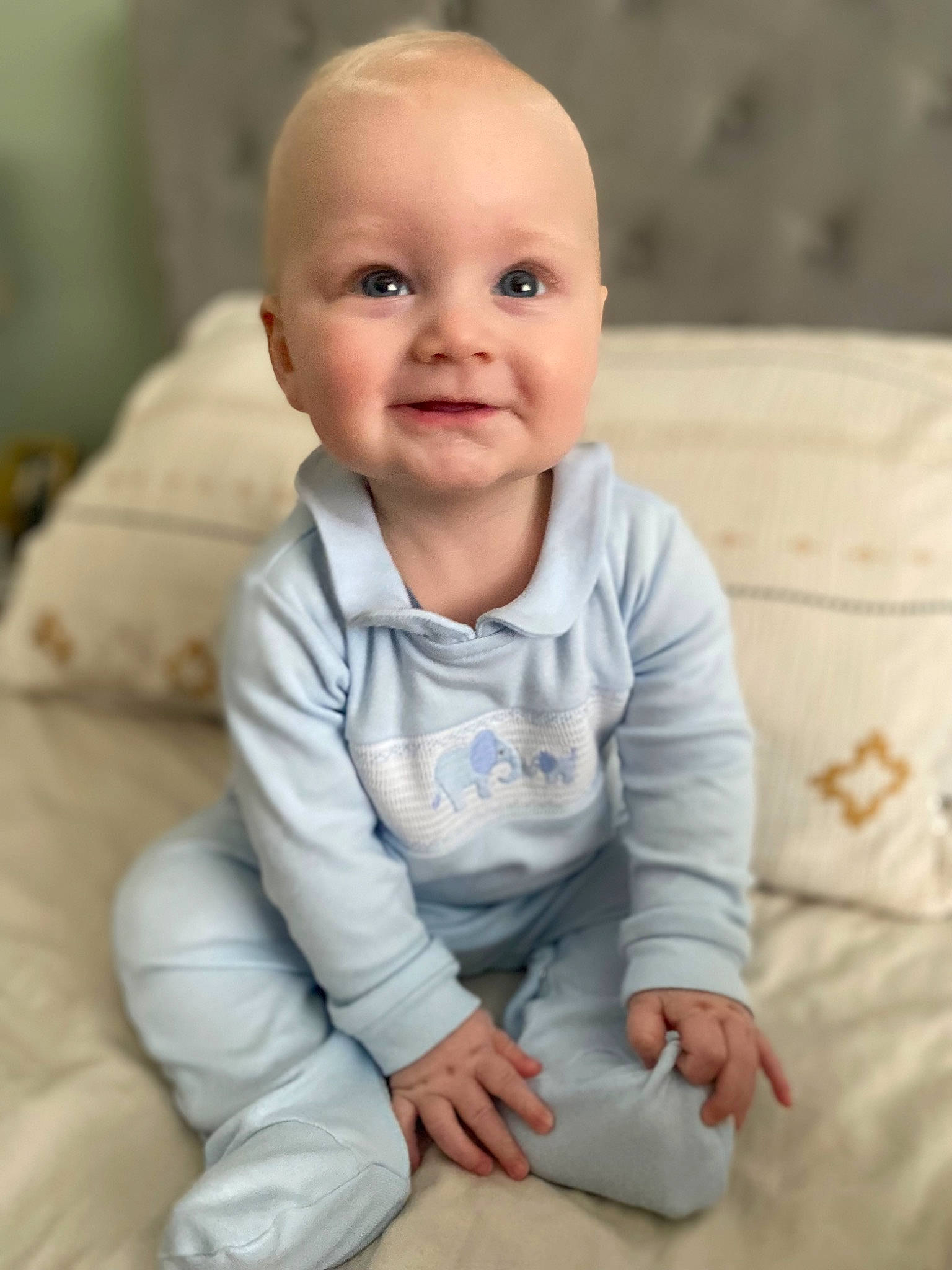 Finley is registered to the contest to win money with this photo: baby, baby_toddler_clothing, cheek, child, collar, comfort, eye, face, flooring, happy, head, joy, linens, person, portrait_photography, product, sitting, skin, sleeve, smile