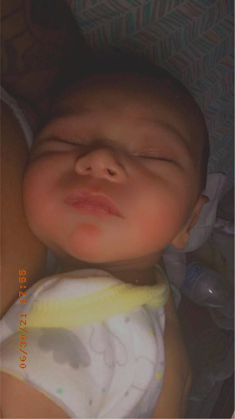 Micheal is registered to the contest to win money with this photo: baby, baby_toddler_clothing, cheek, chin, comfort, eye, eyebrow, finger, forehead, happy, headwear, iris, jaw, lip, mouth, neck, nose, person, skin, sleeve