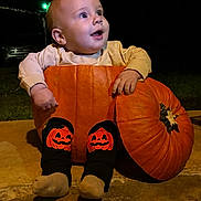 Julien joined the competition — help win amazing prizes! baby, pumpkin, halloween, night, child, smiling, leggings, orange, face, cute, costume, festive, outdoor, happy, sitting, holiday, dark, fun, celebration, feet