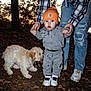 autumn, baby, beanie, casual, child, dog, evening, grass, hands, hoodie, leaves, nature, outdoor, person, pet, plaid_shirt, ripped_jeans, toddler, walking, white_shoes