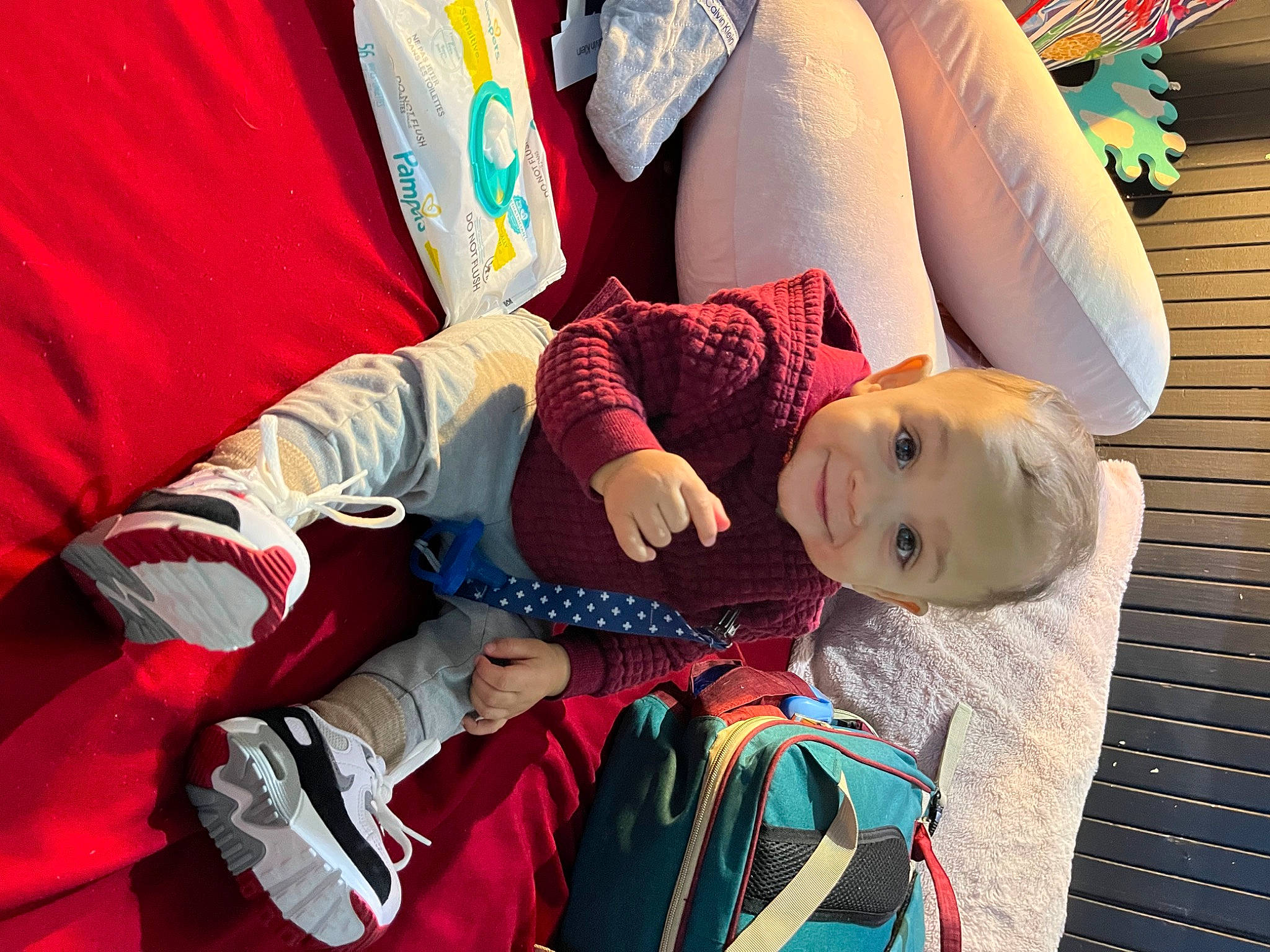 Javon joined the competition — help win amazing prizes! baby, baby_products, carmine, child, comfort, electric_blue, fun, gesture, happy, human_leg, joy, leisure, linens, luggage_and_bags, person, red, sitting, textile, thigh, toddler