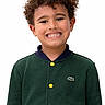 Milan participe au concours pour gagner de l'argent avec cette photo : child, smile, curly_hair, green_jacket, yellow_buttons, portrait, happy, cute, young, fashion, studio, white_background, casual_clothing, person, face, kid, front_view, buttoned_jacket, expression, joyful