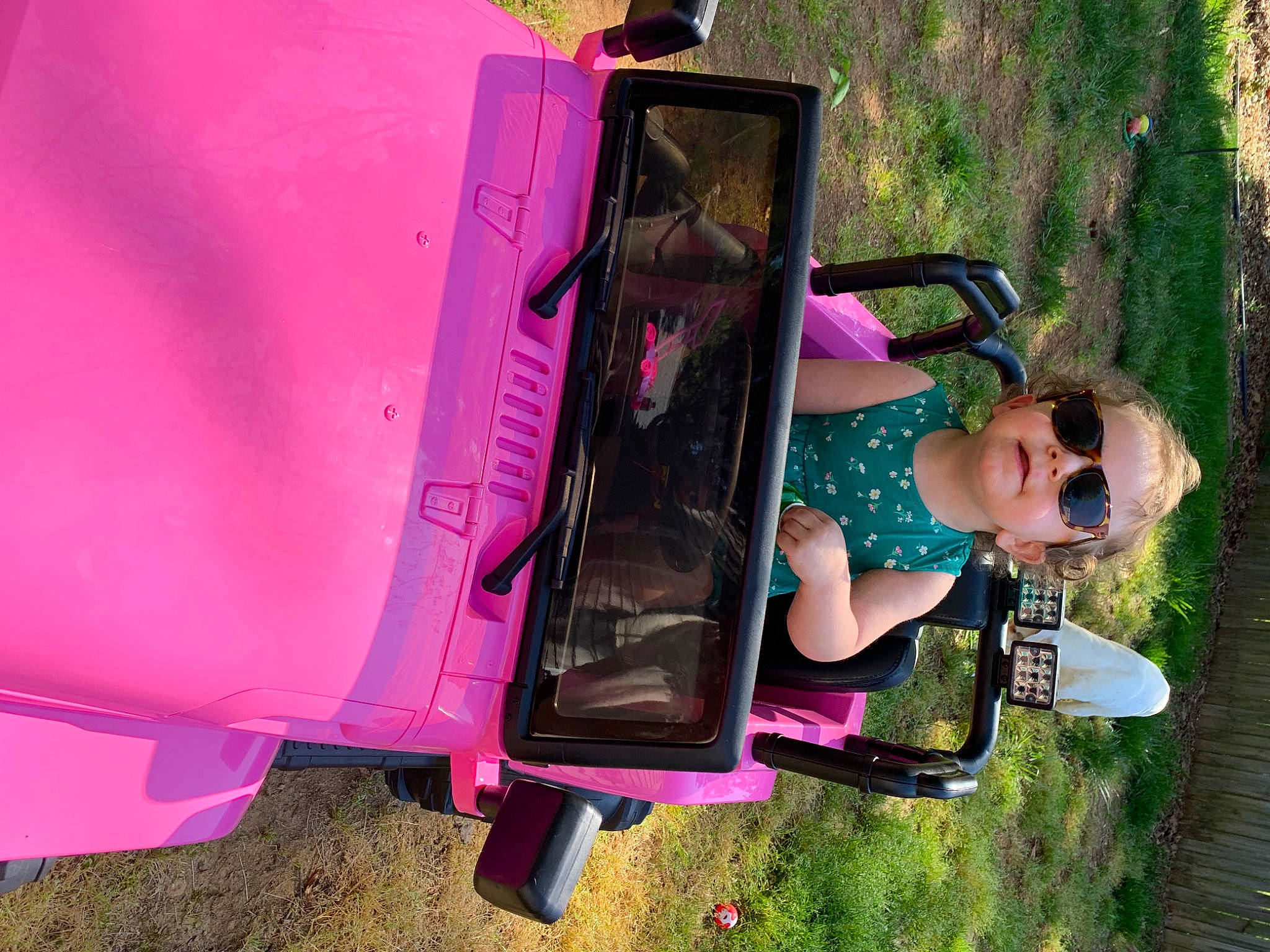 Fallon is registered to the contest to win money with this photo: bumper, child, city, fun, goggles, grass, human_settlement, leisure, magenta, motor_vehicle, person, pink, plant, play, purple, recreation, sunglasses, toddler, tree, vacation