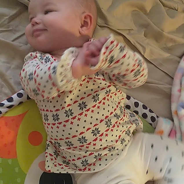 Scarlett joined the competition — help win amazing prizes! arm, baby, baby_safety, baby_toddler_clothing, cheek, comfort, facial_expression, finger, floor, flooring, hairstyle, pattern, pink, skin, sleeve, smile, textile, toddler, toy, white