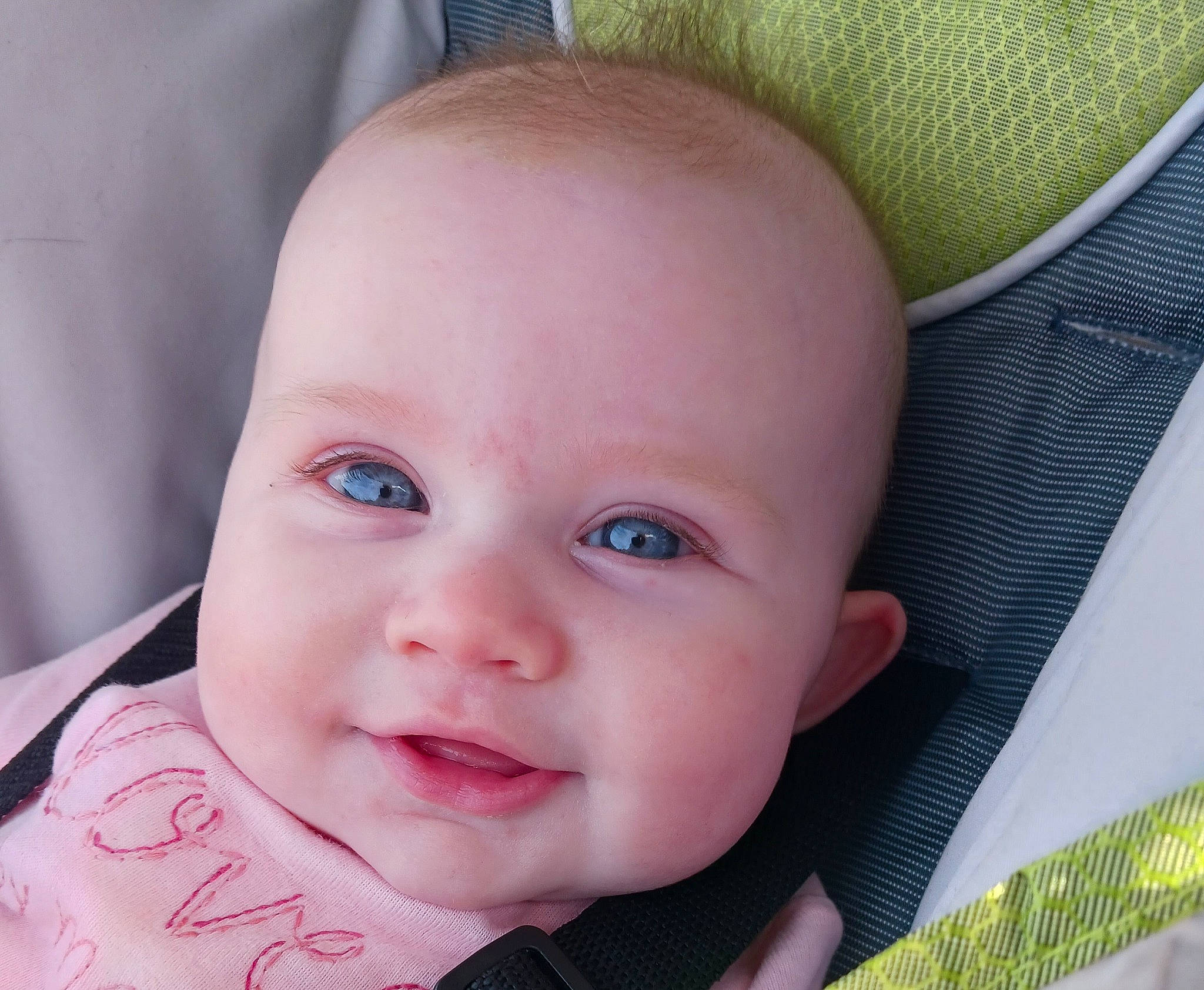 Vanessa joined the competition — help win amazing prizes! baby, baby_products, baby_toddler_clothing, cheek, child, close_up, comfort, ear, eyelash, fashion_accessory, grass, happy, iris, linens, nose, person, sitting, skin, smile, textile