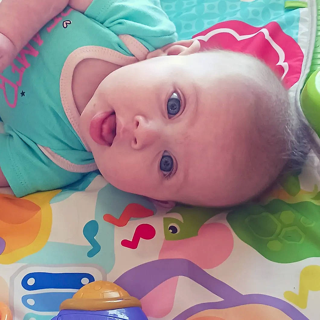 Vanessa is registered to the contest to win money with this photo: baby, baby_products, baby_toddler_clothing, cheek, child, chin, eyebrow, eyelash, fun, happy, iris, lip, nose, pattern, person, pink, skin, smile, textile, toddler