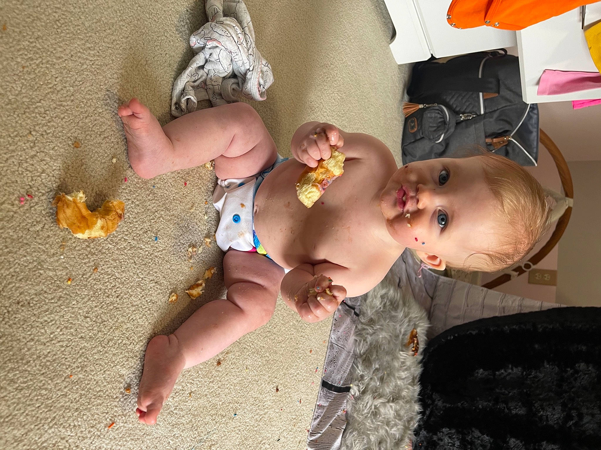 Kayleigh is registered to the contest to win money with this photo: abdomen, baby, baby_products, baby_toddler_clothing, barechested, chest, child, fashion_accessory, flooring, foot, fun, hairstyle, happy, mouth, person, sitting, skin, smile, thigh, toddler