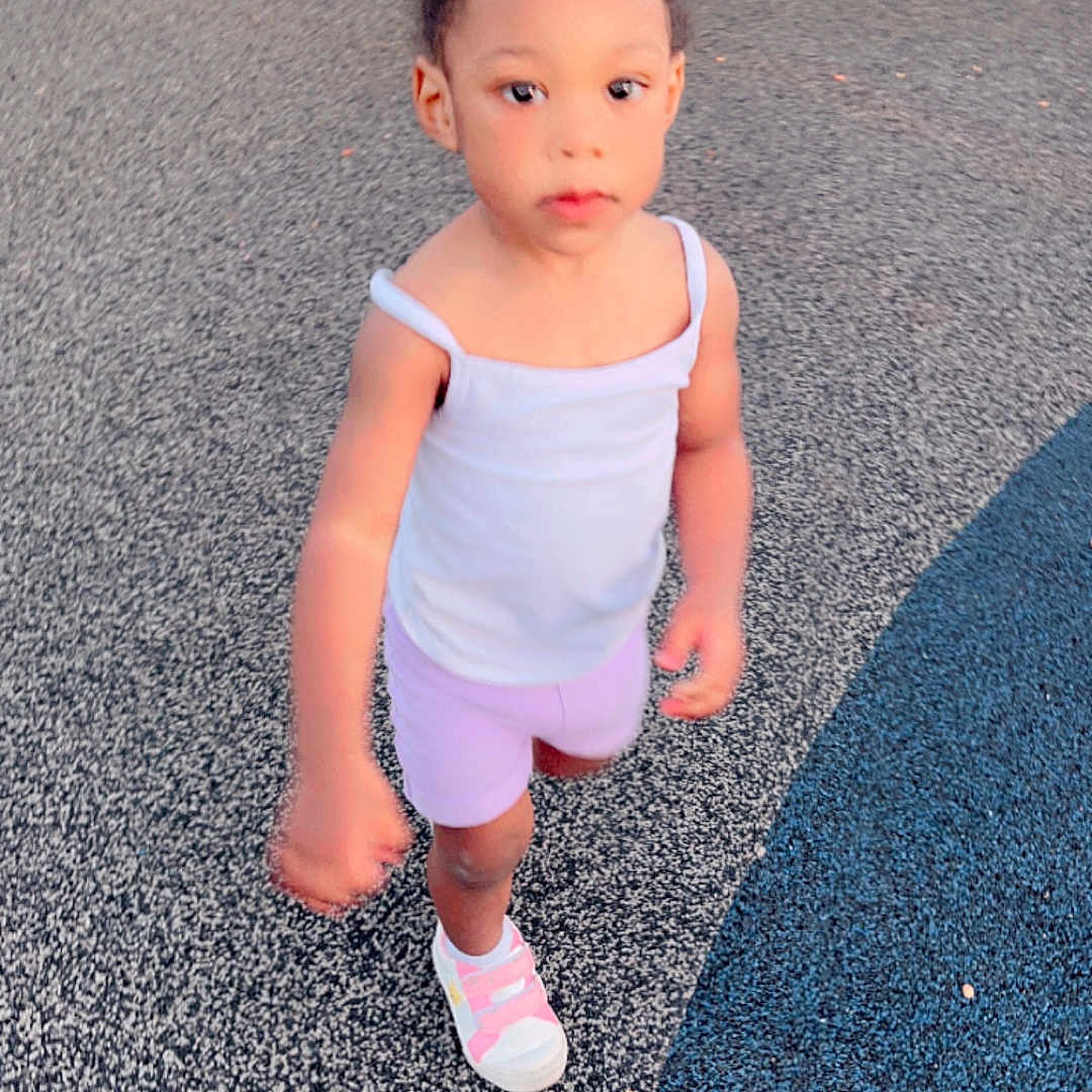 Kehlani is registered to the contest to win money with this photo: child, clothing, dress, face, female, footwear, girl, head, outdoorplayarea, outdoors, pants, person, photography, playarea, portrait, road, shoe, shorts, standing, walking