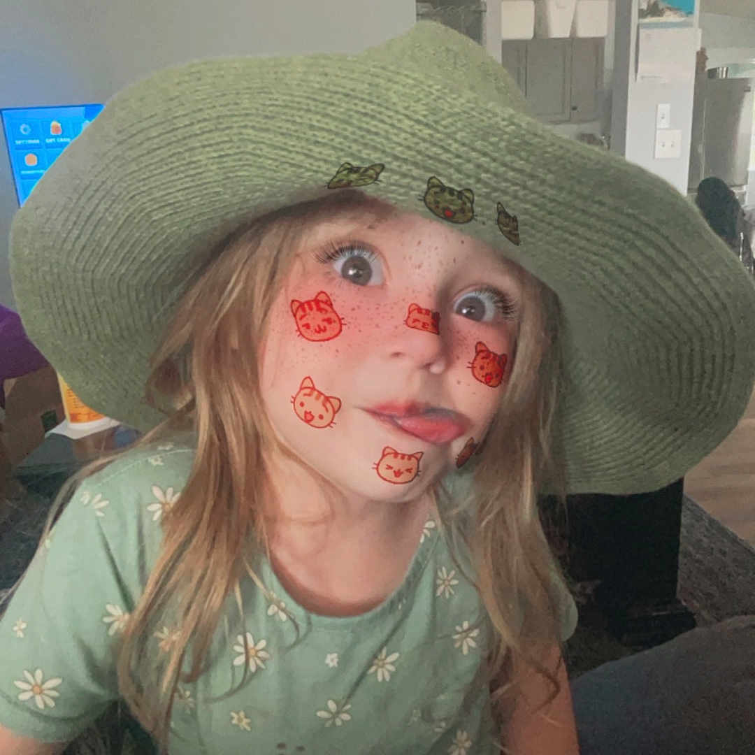 Willow is registered to the contest to win money with this photo: bodypart, cap, child, clothing, cosmetics, costume, dress, face, female, girl, hat, head, lipstick, mouth, person, photography, portrait, selfie, sunhat, teeth