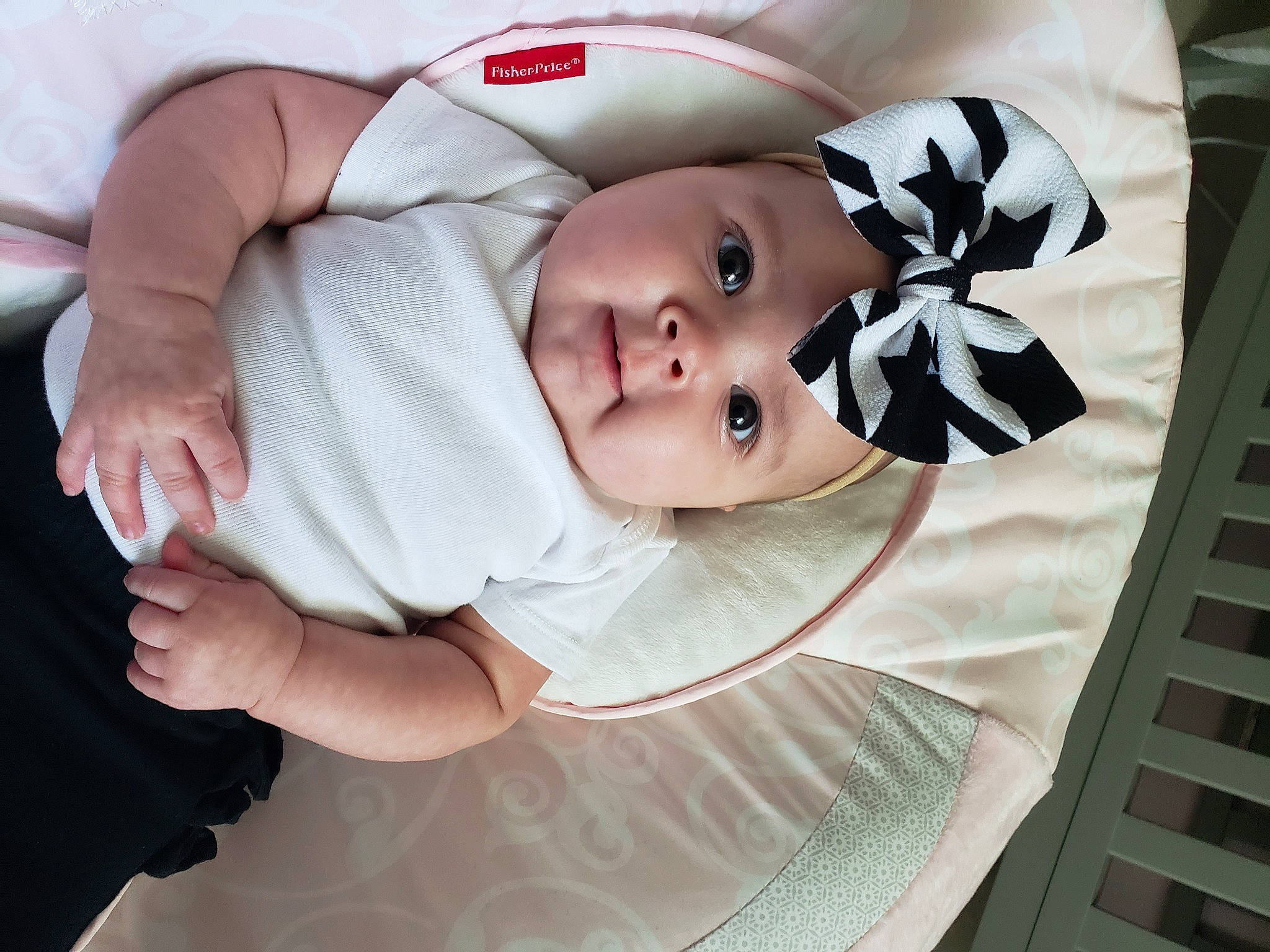 Ensley is registered to the contest to win money with this photo: baby, baby_products, baby_toddler_clothing, cheek, child, comfort, elbow, eyebrow, eyelash, face, gesture, happy, head, headwear, human_body, linens, lip, pattern, person, sleeve
