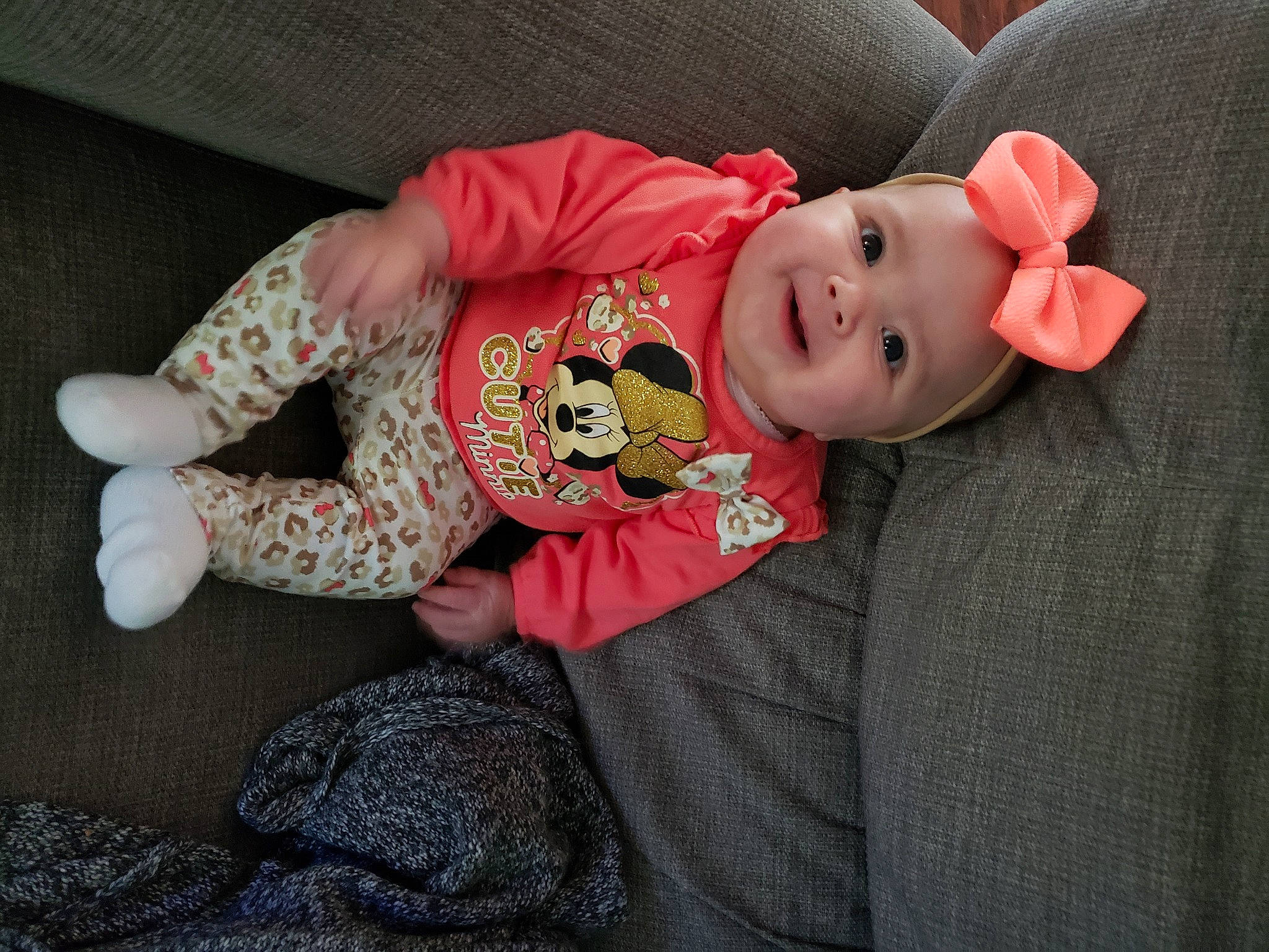 Ensley is registered to the contest to win money with this photo: baby, baby_toddler_clothing, carmine, cheek, child, comfort, costume_hat, eye, face, flooring, happy, hat, headgear, headwear, human_body, joy, person, skin, sleeve, smile