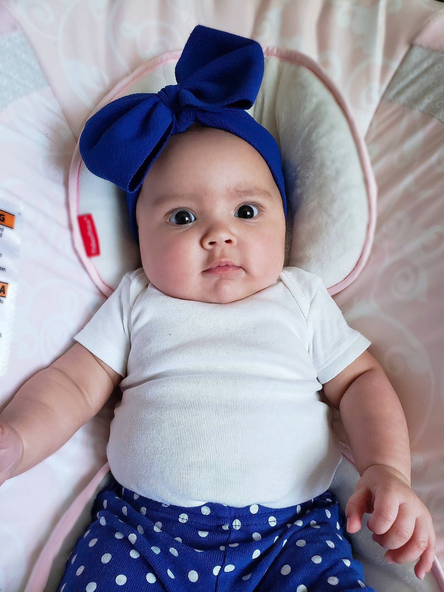 Ensley joined the competition — help win amazing prizes! azure, baby, baby_toddler_clothing, blue, cap, cheek, face, facial_expression, happy, headwear, iris, organ, outerwear, person, pink, product, skin, sleeve, standing, t_shirt