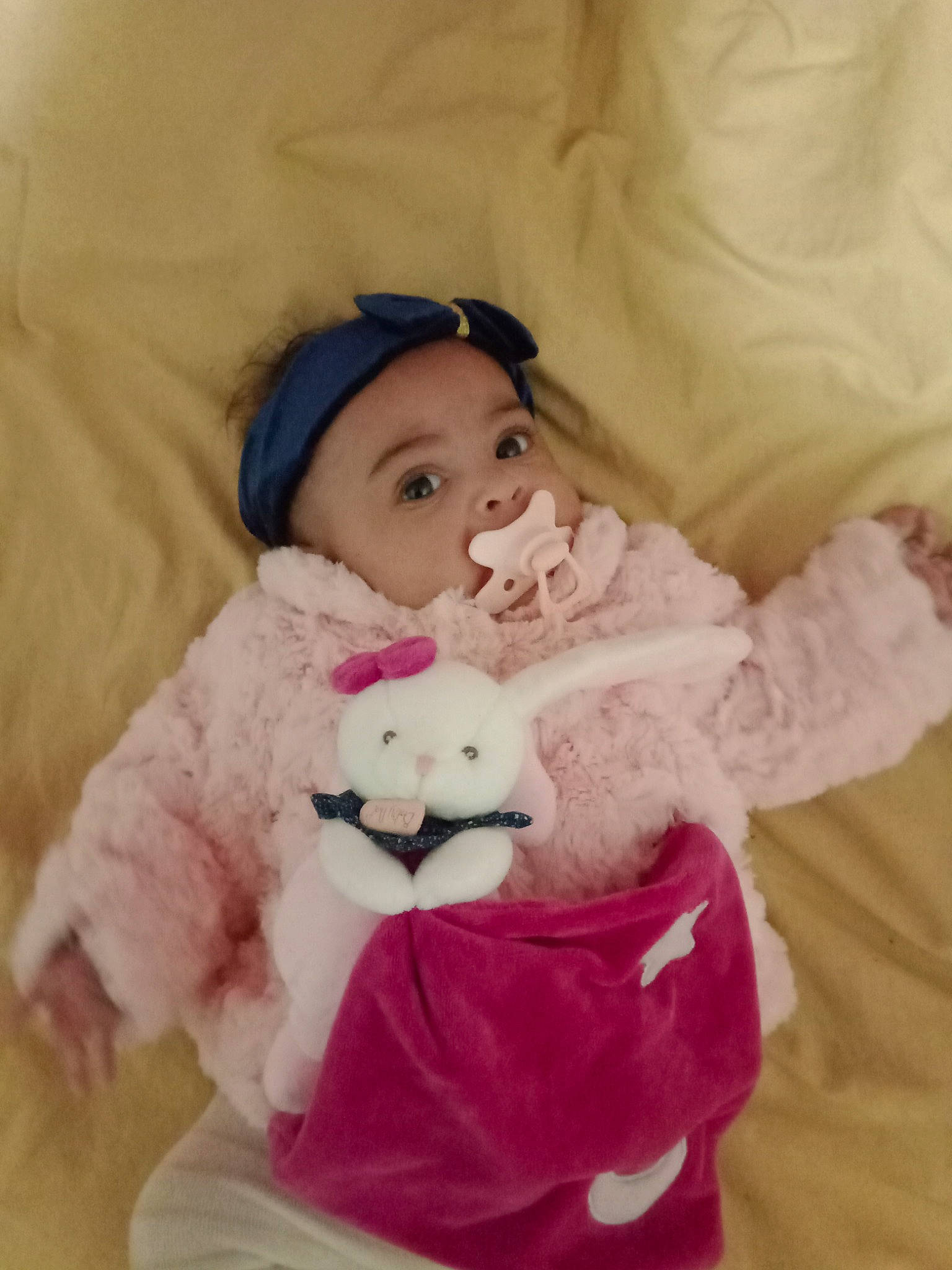 Mélodye participe au concours pour gagner de l'argent avec cette photo : baby, baby_toddler_clothing, cheek, comfort, eye, fur, happy, head, headgear, headwear, linens, magenta, person, pink, purple, skin, sleeve, stuffed_toy, teddy_bear, textile