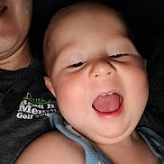 Jordan joined the competition — help win amazing prizes! baby, child, person, smiling, open_mouth, closeup, selfie, happy, face, skin, head, shoulder, tank_top, adult, text_on_clothing, indoor, casual, portrait, joyful, candid