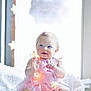 Charlee joined the competition — help win amazing prizes! baby, blanket, blonde_hair, blue_eyes, child, cozy, cute, decorative_lights, fairy_lights, flower_lights, girl, happy, indoor, pink_dress, portrait, sitting, smiling, soft_lighting, toddler, window_light