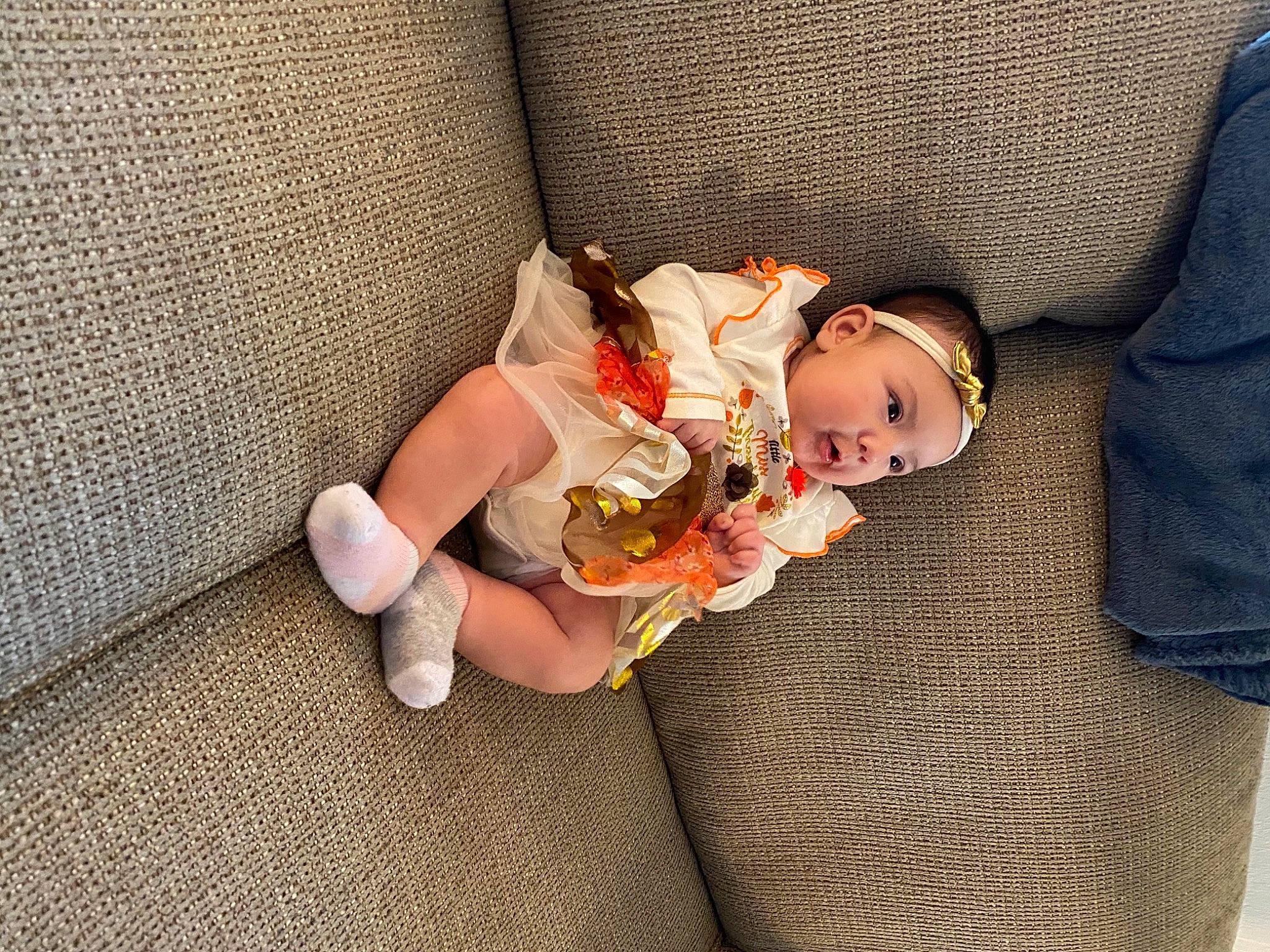 Serena is registered to the contest to win money with this photo: baby, baby_products, baby_toddler_clothing, baby_toys, beanie, child, comfort, foot, headwear, peach, person, sock, stuffed_toy, toy