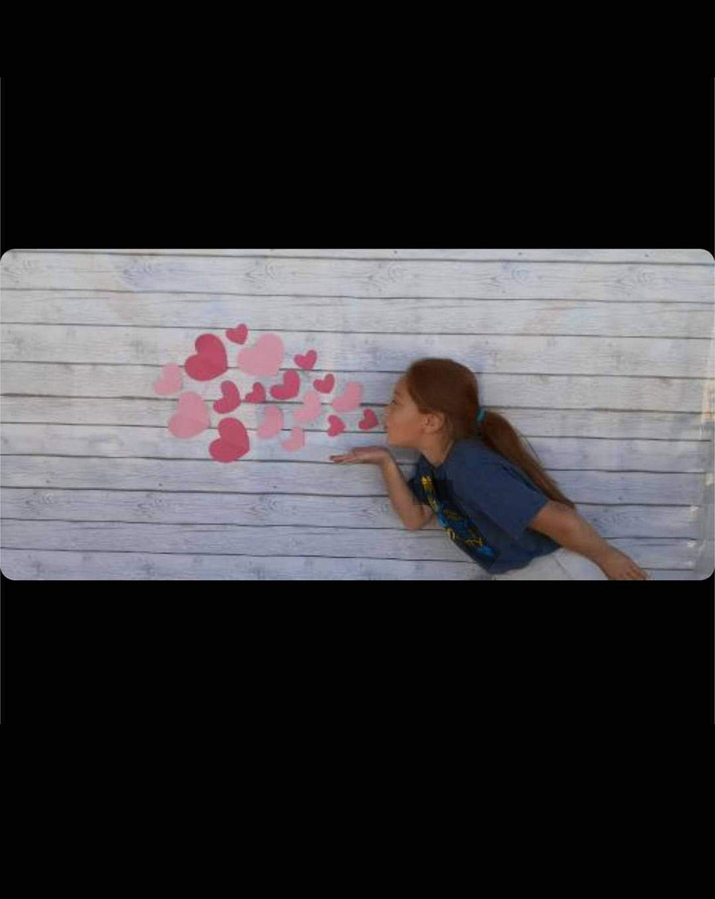 Sarai is registered to the contest to win money with this photo: child, display_device, floor, flooring, font, gadget, hardwood, leisure, magenta, pattern, person, petal, plywood, product, rectangle, room, sitting, t_shirt, tints_and_shades, visual_arts