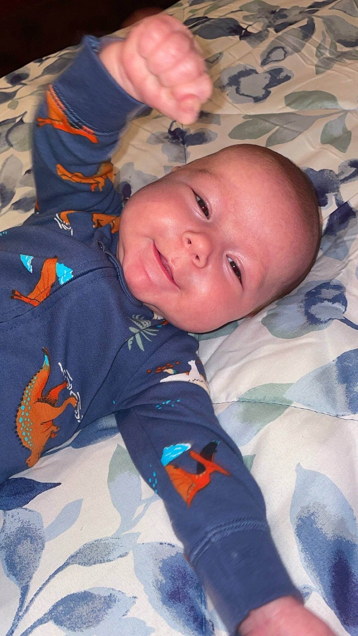 Navvy is registered to the contest to win money with this photo: baby, baby_toddler_clothing, cheek, child, comfort, electric_blue, eye, face, forehead, fun, gesture, happy, iris, linens, mouth, nose, person, sleeve, smile, thumb