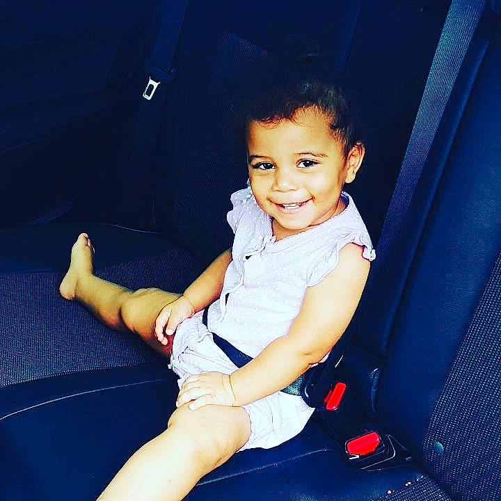 Kadence is registered to the contest to win money with this photo: ankle, baby, baby_toddler_clothing, car_seat, child, comfort, elbow, finger, foot, human_leg, joy, knee, lap, laugh, nail, person, pleased, shoe, sitting, sock