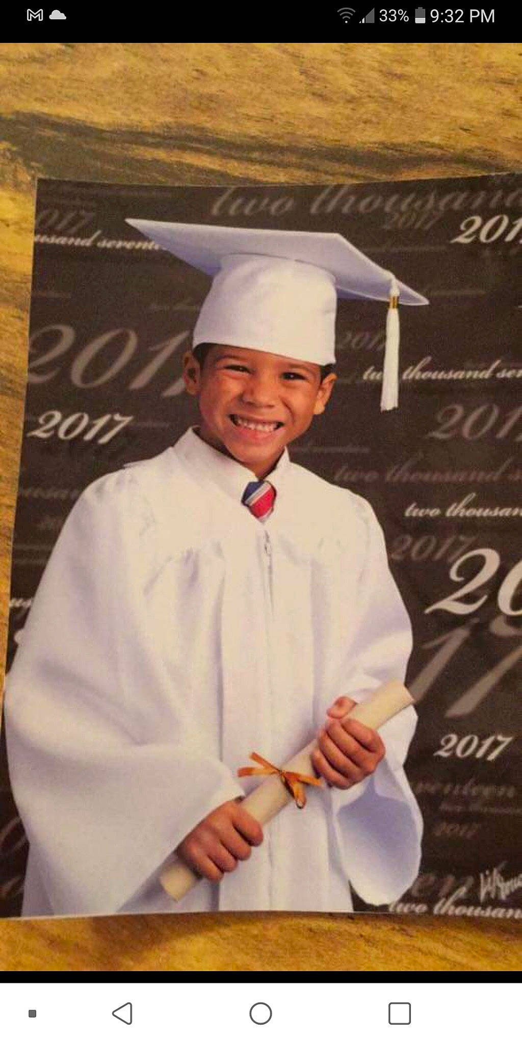 Kellen is registered to the contest to win money with this photo: academic_dress, bow_tie, ceremony, chef, collar, cook, costume_accessory, facial_expression, gesture, graduation, hand, happy, headgear, headwear, joy, laugh, mortarboard, person, scholar, tie