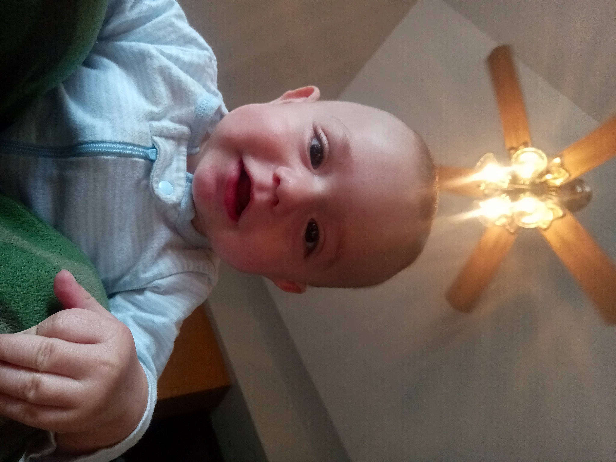 Elijah is registered to the contest to win money with this photo: baby, baby_toddler_clothing, ceiling, ceiling_fan, cheek, child, eye, eyelash, finger, flash_photography, fun, hand, happy, human_body, mechanical_fan, nose, person, smile, thumb, toddler