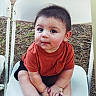 baby, child, infant, portrait, sitting, chair, outdoor, grass, smiling, face, eyes, hair, orange_shirt, black_shorts, barefoot, folding_chair, backyard, cute, person, photography