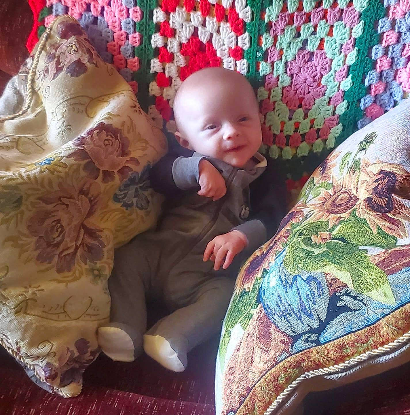 Aydin is registered to the contest to win money with this photo: baby, baby_products, baby_sleeping, baby_toddler_clothing, bedding, comfort, couch, eye, head, lap, leg, linens, mammal, pattern, person, sitting, sleeve, textile, toddler, vertebrate