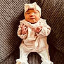 baby, infant, couch, clothing, headband, booties, white_clothes, frills, texture, soft_lighting, indoors, portrait, cute, small_hands, seated, comfortable, fashion, child, newborn, cozy