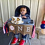 Roman joined the competition — help win amazing prizes! child, baby, toddler, highchair, cake, smash_cake, frosting, messy_face, red_shoes, banner, birthday, party, balloons, plate, hand, jeans, sweater, food, celebration, decor